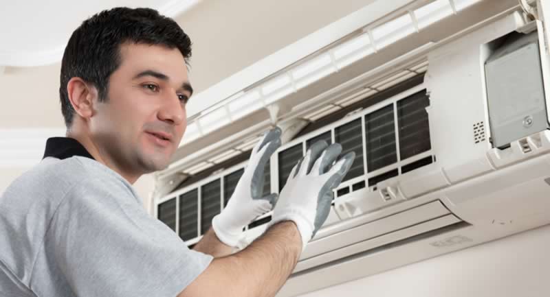 technician installing ductless ac
