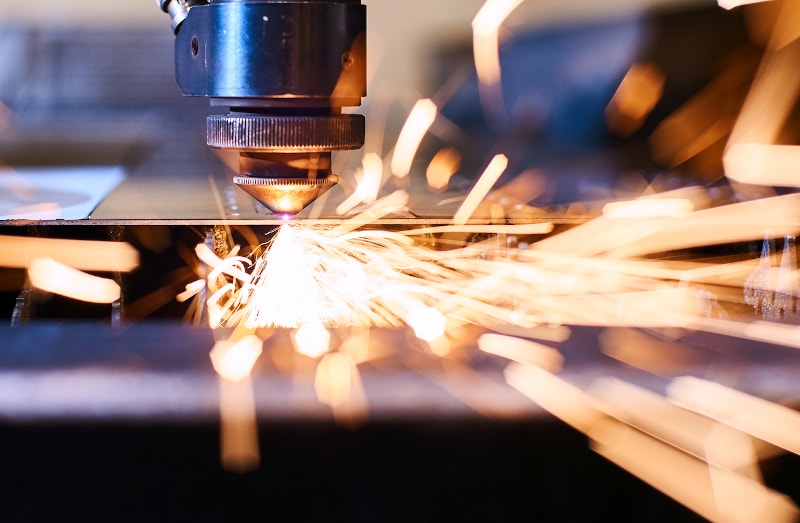 sheet metal being cut with a thermal laser cutter