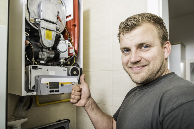 Repair Man Fixing Furnace